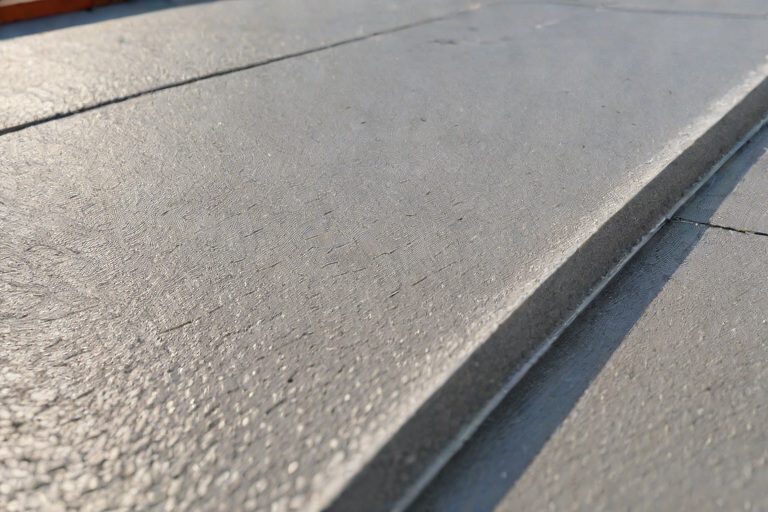 AOC 581 Elastomeric Structural Mastic Detailing Around Rooftop HVAC Curbs on Commercial Port Marine Shipping Warehouses